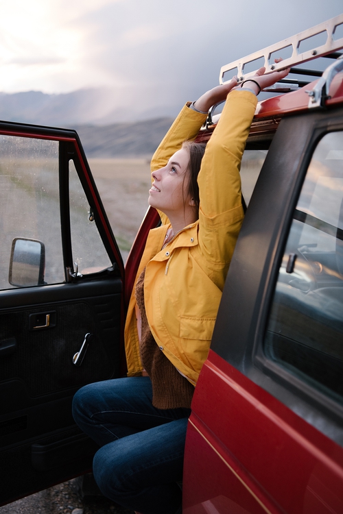 Woman getting out of car